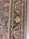 Hand knotted Persian rug dark midnight blue border featuring angular vines, palmettes, and floral motifs.