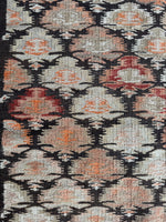 Close up of antique flat weave runner with subtle and bold color mix.
