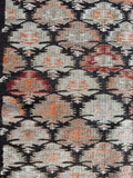 Close up of antique flat weave runner with subtle and bold color mix.