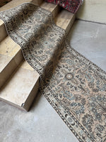 Well-woven 27-foot Persian rug with botanical details.
