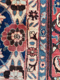 Close up of border band botanical design of antique village-woven Persian Veramin rug.