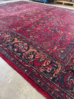 Handwoven Lilihan rug featuring rich jewel-toned florals.