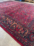 Handwoven Lilihan rug featuring rich jewel-toned florals.