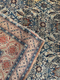 1920s antique wool Persian rug showing corner construction, outer guard border, and clean fringe edge.
