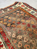 Late 19th century Caucasian tribal rug showcasing 100% vegetable-dyed wool in rich, aged colors.