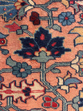 Low pile Persian Heriz area rug texture close up illustrating rugged weave and authentic age wear.