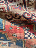 1900s Caucasian mountain runner rug with a soft floppy handle and natural vegetable dyes.