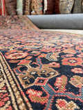 Vegetable-dyed wool Malayer rug close-up capturing the warm tones and time-tested fiber quality.