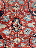 Close-up of unusual Heriz rug showing stylized flower forms and aged wool

