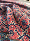 Antique Bidjar rug featuring floral shapes and French blue accents.