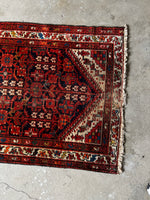 Ivory spandrels contrasting with the deep blue field of a Malayer rug.