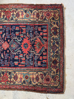 Wool Kurdish rug with traditional Persian design.