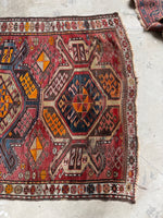 Close look at the opposite end with faded dyes and eight-pointed stars.
