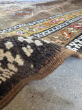 Antique tribal wool runner with welcoming yellow border and beautiful age throughout.