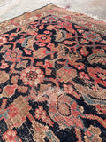 Vintage Herati water garden runner showing intricate small-scale patterns across the distressed dark wool field.