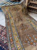 Early 1900s handwoven runner with vegetable dyed wool and cheerful yellow floral border.