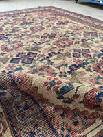 Persian Afshar rug featuring wine-kissed aubergine details and floral shapes.