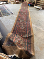 Antique Persian wool runner with rustic character and charm.