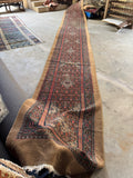 Antique Persian wool runner with rustic character and charm.