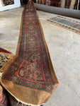 Antique 1920s Persian runner with lattice design and floating medallions.