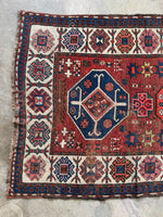 Nearly 9-foot-long tribal runner with wool foundation and raw fringes.