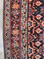 Border showing intricate star motifs in varied vegetable dye tones