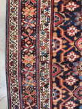 Border showing intricate star motifs in varied vegetable dye tones