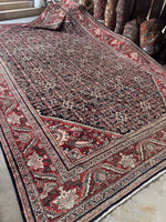 Large Persian Mahal rug with rusty red border and floral accents