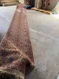 Extra long hallway runner 21 ft 5 in by 35 in with intricate floral pattern and soft earth tones.