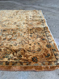 Corner view of 2'8 x 20'8 golden extra long Persian runner with soft wool sheen and elegant floral artwork.