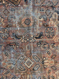 11x17 oversized Persian rug surface close up revealing natural vegetable dye abrash shifts and scattered wear.
