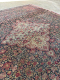 Midnight blue field with dense floral design on Persian Ferahan rug.