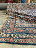 Detail of pink and blue color combination in an antique Ferahan Mahal wool rug.