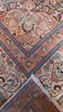 Close-up of the fine, tight wool weave on a large antique Persian Tabriz rug.