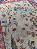 Fine weave Tabriz pictorial rug detail photo showcasing a horseman with a saber framed by a weeping willow tree.