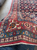 Tehran Persian carpet showcasing authentic hand-spun vegetable-dyed wool yarn.