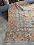 One end view of large antique Persian rug with a color palette that will  be easy to style.