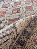Small batch dyed rug close-up revealing subtle color shifts and hand-knotted wool craftsmanship.