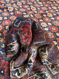 Plush tribal wool rug with a flexible weave that folds like a blanket.