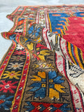 Low pile wool area rug featuring floppy handle and weighted antique feel.