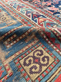 Distressed blue Caucasian area runner rug in 3x8 size for hallway or entry spaces.