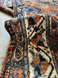 Border band of antique Southwest Persian Shiraz rug with floral shrubs and tribal medallions.