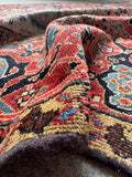 Timeworn antique Persian runner featuring organic vegetable dyes and a charmingly relaxed handle.