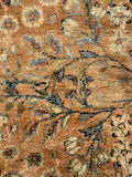 Close up of a 2'8 x 20'8 golden 20 foot antique Persian runner for hallways with elegant floral vines and soft vintage colors.
