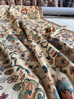 Persian rug with medium-sized motifs in rich color tones.