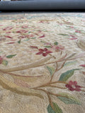 Close up view of antique Aubusson flatweave tapestry with graceful French floral motifs and artistic woven detail.