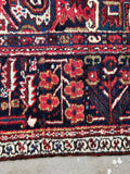 Large geometric Persian rug. Antique Heriz carpet with tribal artwork, rich vegetable dyes, and sturdy heirloom-quality construction.