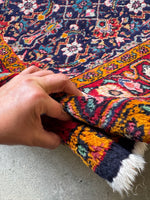 Full pile vintage Persian rug showcasing healthy wool and rich colors.