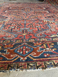 Hand knotted Persian Heriz rug. Antique geometric wool rug with a terracotta field, graphic allover pattern, and sturdy Northwest Persian construction.