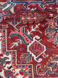 Handmade Persian Heriz rug. Large antique area rug with ivory spandrels, geometric medallion, and richly aged vegetable-dyed wool.